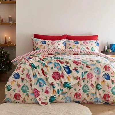 Image de Catherine Lansfield Parure de lit réversible avec Housse Couette et taies d&#039;oreiller Motif Jolly Jumpers Crème