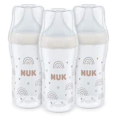 Image de Set de biberons NUK Perfect Match 3+ mois S’adapte au palais bébé Contrôle température Évent anti coliques 260 ml Sans BPA TÉTINE M en silicone Arc ciel 3 pces