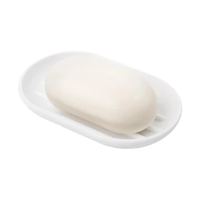 Image de UMBRA Soap Dish Touch. Porte savon Touch en plastique moulé. Coloris blanc. Dimension 12.7x8.3x1.9cm.