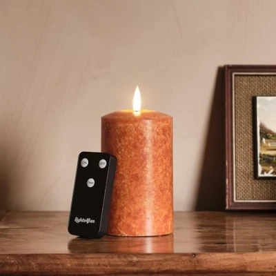 Image de Lights4fun TruGlow® Bougie Sans Flamme à LED Blanc Chaud Piles en Cire Véritable Orange de 12,5 cm avec Minuterie et Télécommande Décoration d&#039;Automne