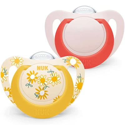Image de NUK Star Baby Lot de 2 tétines en silicone sans BPA pour bébé 18 à 36 mois, apaise 99% des bébés, motif fleurs jaunes
