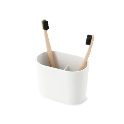 Image de UMBRA Toothbrush holder Step. Porte brosse à dents En mélamine brillante. Coloris blanc. Dimension 12x7.6x10.2cm