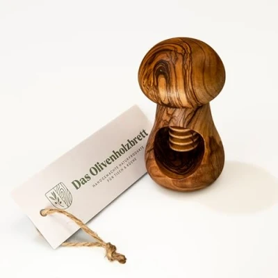 Image de das Olivenholzbrett® Casse noix avec filetage en bois d&#039;olivier forme de champignon/casse