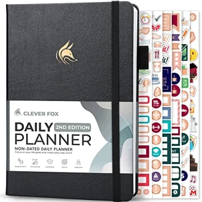 Image de Clever Fox Agenda journalier 2e édition Organiseur de tâches en bloc horaire non daté avec et liste choses à faire A5, 6 mois (noir argenté)